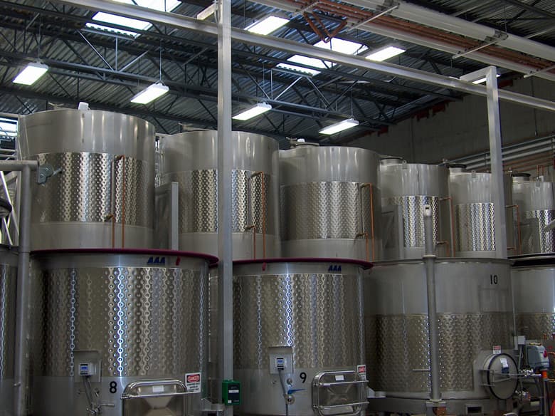 Barrels of wine stacked in a cellar